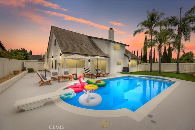 24091 Marathon St, Mission Viejo, CA 92691 - pool at dusk featuring a patio and a fenced backyard