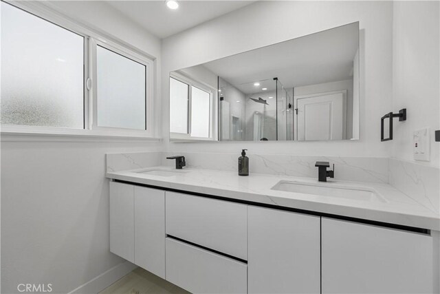 24091 Marathon St, Mission Viejo, CA 92691 - bathroom with double vanity, a marble finish shower, healthy amount of natural light, and recessed lighting