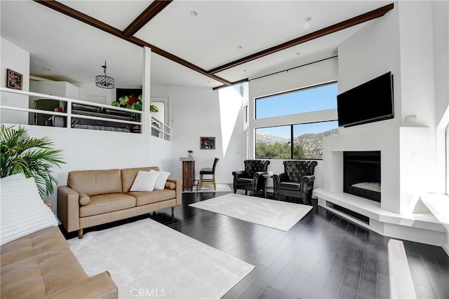 8742 Azul Dr, West Hills, CA 91304 - living area with a fireplace with raised hearth, wood finished floors, and a high ceiling