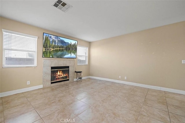 43939 Glenraven Rd, Lancaster, CA 93535 - unfurnished living room featuring a tile fireplace and tile patterned floors
