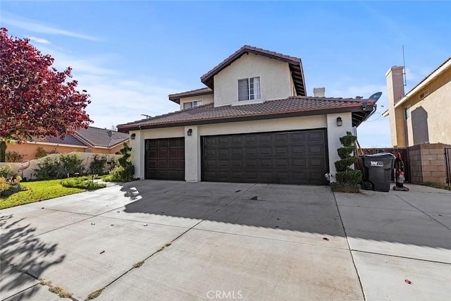 43939 Glenraven Rd, Lancaster, CA 93535 - view of front facade with concrete driveway, stucco siding, a tiled roof, and a garage