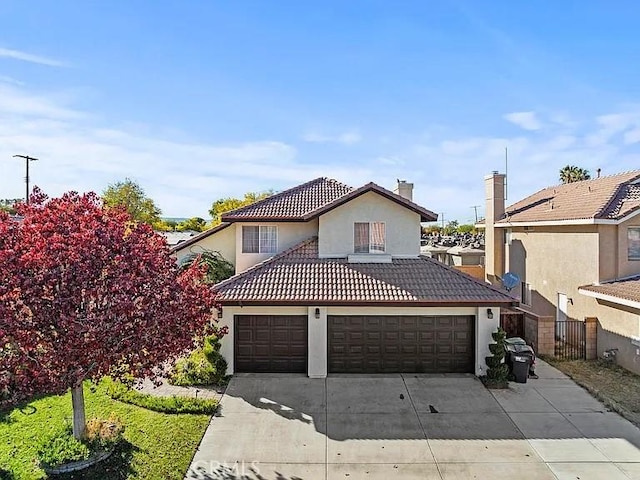 43939 Glenraven Rd, Lancaster, CA 93535 - view of front of home with concrete driveway, stucco siding, a tiled roof, and a chimney