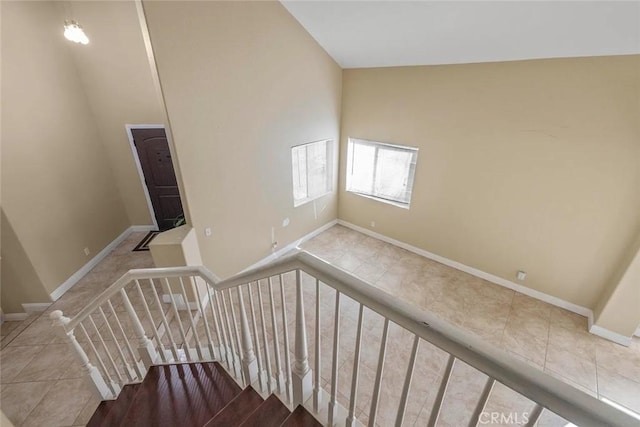 43939 Glenraven Rd, Lancaster, CA 93535 - staircase with baseboards and tile patterned flooring