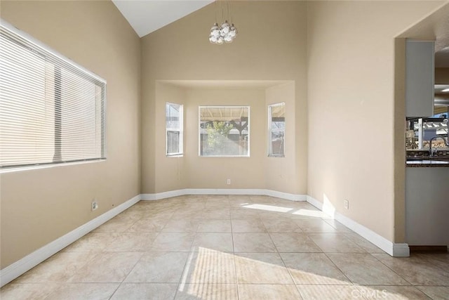 43939 Glenraven Rd, Lancaster, CA 93535 - empty room with light tile patterned floors and vaulted ceiling