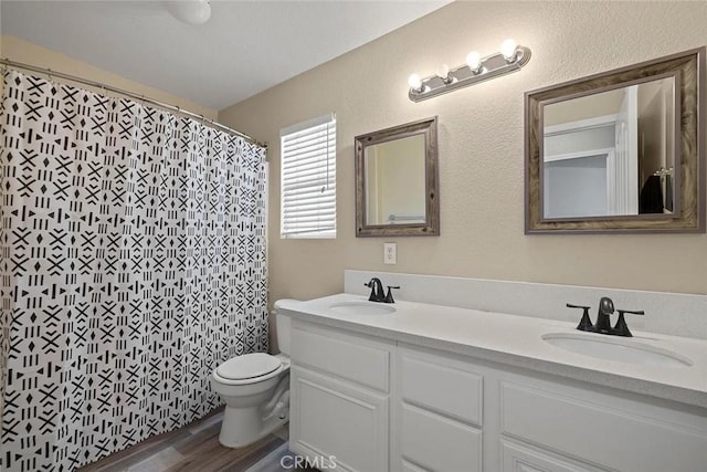 43939 Glenraven Rd, Lancaster, CA 93535 - bathroom with double vanity, wood finished floors, and curtained shower