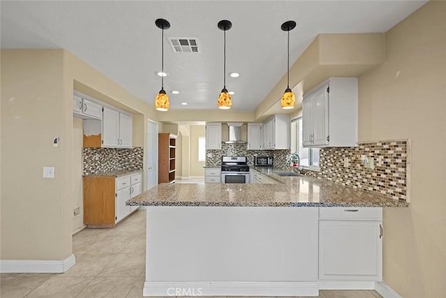 43939 Glenraven Rd, Lancaster, CA 93535 - kitchen with stainless steel stove, a peninsula, backsplash, light stone counters, and recessed lighting