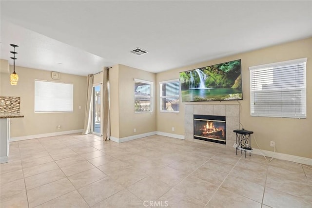 43939 Glenraven Rd, Lancaster, CA 93535 - unfurnished living room with a tile fireplace and light tile patterned floors