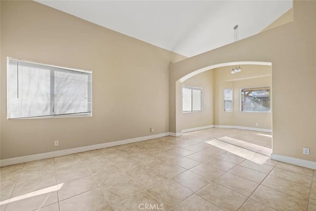 43939 Glenraven Rd, Lancaster, CA 93535 - tiled spare room featuring vaulted ceiling and arched walkways