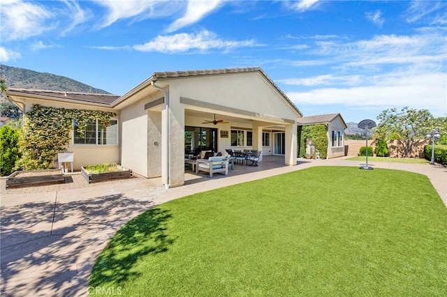 538 Francesca Ln, Glendora, CA 91741 - rear view of house featuring a yard, a ceiling fan, a patio, stucco siding, and a vegetable garden