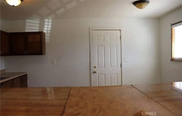 16226 Pine St, Hesperia, CA 92345 - kitchen featuring dark brown cabinets and light countertops
