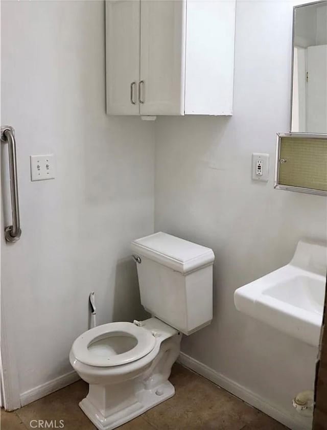 16226 Pine St, Hesperia, CA 92345 - bathroom with baseboards and toilet