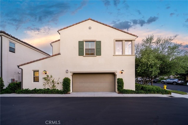 113 Soaring Eagle, Irvine, CA 92618 - mediterranean / spanish-style home featuring stucco siding, an attached garage, and a tiled roof