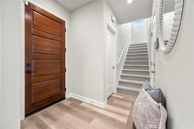 113 Soaring Eagle, Irvine, CA 92618 - foyer featuring light wood finished floors, stairway, and recessed lighting