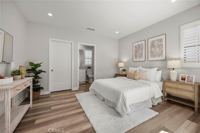 113 Soaring Eagle, Irvine, CA 92618 - bedroom featuring light wood-style flooring, recessed lighting, and ensuite bathroom