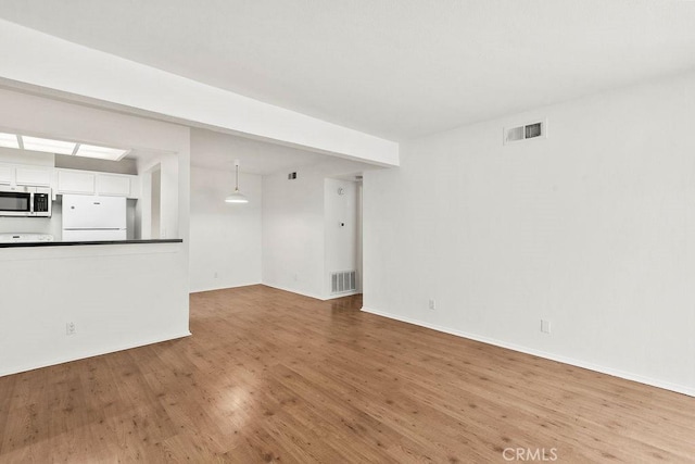 13104 Glen Ct Unit 7, Chino Hills, CA 91709 - unfurnished living room featuring wood finished floors and baseboards