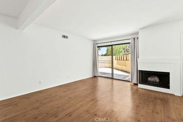 13104 Glen Ct Unit 7, Chino Hills, CA 91709 - unfurnished living room featuring wood finished floors and a fireplace