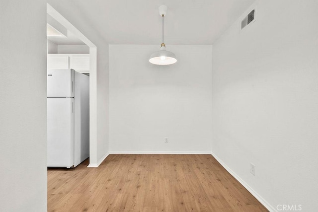 13104 Glen Ct Unit 7, Chino Hills, CA 91709 - unfurnished dining area with light wood finished floors and baseboards