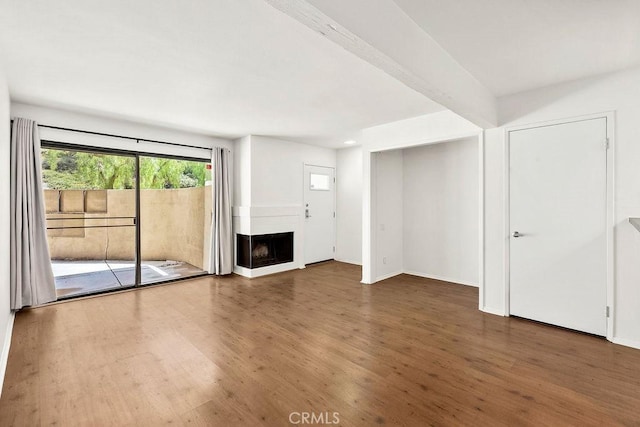 13104 Glen Ct Unit 7, Chino Hills, CA 91709 - unfurnished living room featuring wood finished floors and a multi sided fireplace