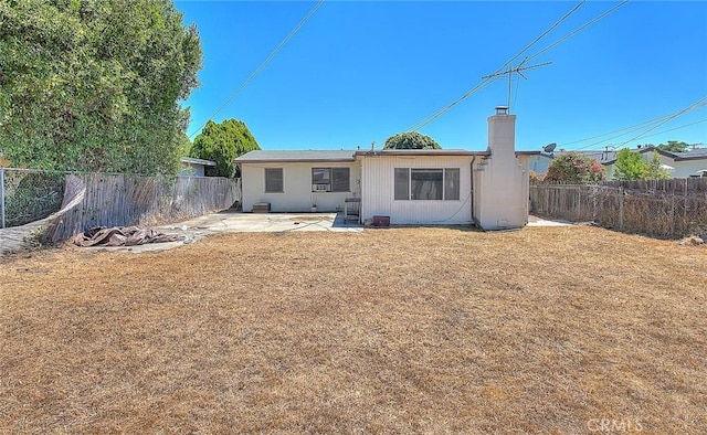 833 W Orangepath St, Glendora, CA 91741 - rear view of house with a fenced backyard, a chimney, and a patio area