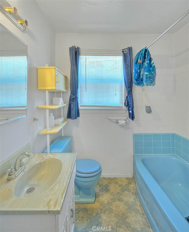 833 W Orangepath St, Glendora, CA 91741 - full bathroom with vanity, shower / bathtub combination, and stone finish floors