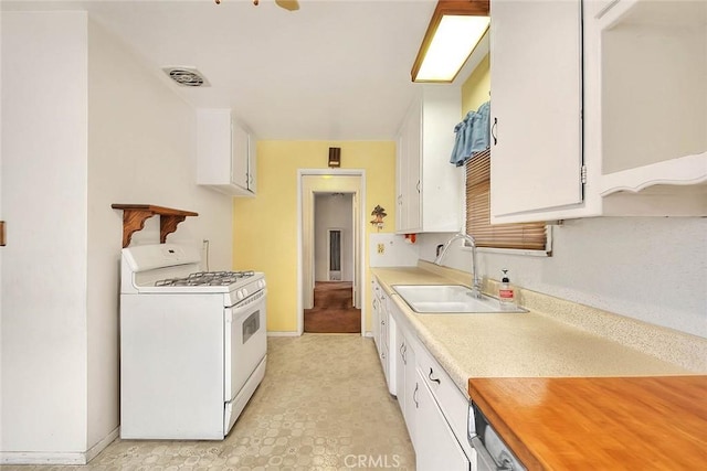 833 W Orangepath St, Glendora, CA 91741 - kitchen featuring white range with gas cooktop, white cabinets, and light countertops