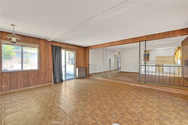 833 W Orangepath St, Glendora, CA 91741 - unfurnished room featuring a textured ceiling, wooden walls, and cooling unit