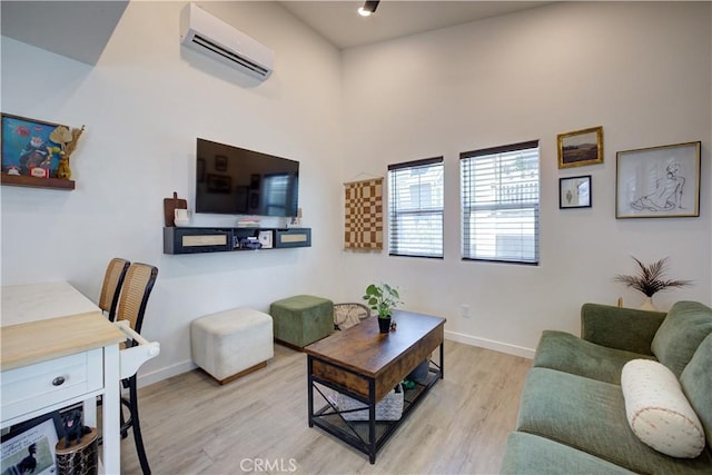 5926 Gran Paseo Way, Atascadero, CA 93422 - living room featuring a wall mounted AC and wood finished floors