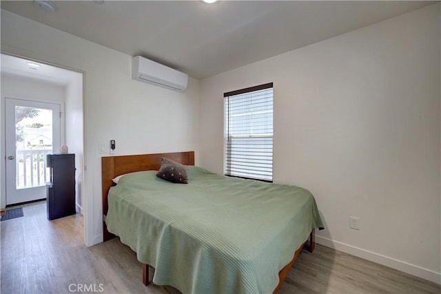 5926 Gran Paseo Way, Atascadero, CA 93422 - bedroom with an AC wall unit and wood finished floors