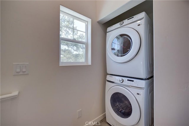 5926 Gran Paseo Way, Atascadero, CA 93422 - laundry area featuring stacked washer / dryer and baseboards
