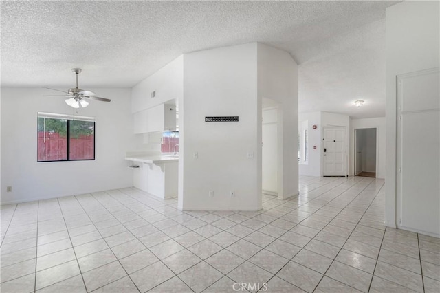 41384 Collegian Way, Hemet, CA 92544 - empty room with a ceiling fan, light tile patterned floors, and a textured ceiling