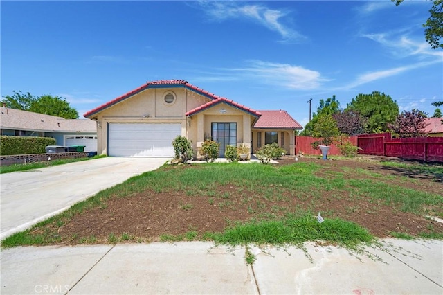 41384 Collegian Way, Hemet, CA 92544 - mediterranean / spanish-style home with a garage, stucco siding, concrete driveway, and a tile roof