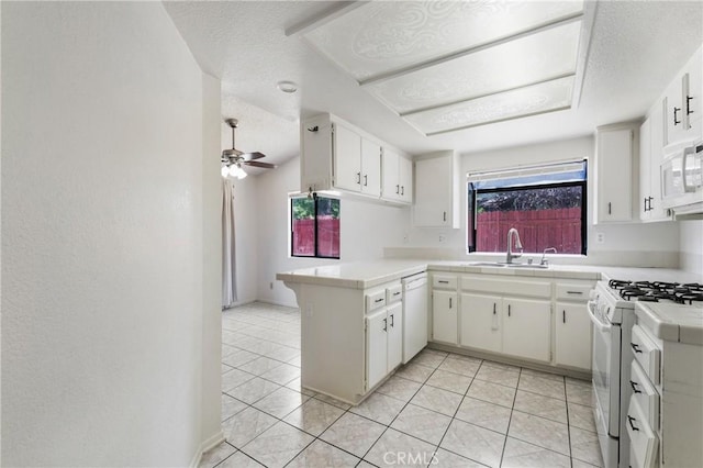41384 Collegian Way, Hemet, CA 92544 - kitchen featuring white appliances, a peninsula, a textured ceiling, light tile patterned flooring, and a ceiling fan