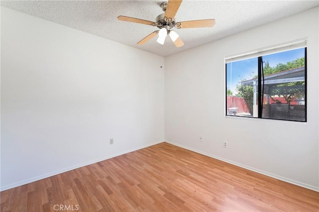 41384 Collegian Way, Hemet, CA 92544 - empty room with light wood finished floors, a textured ceiling, and ceiling fan