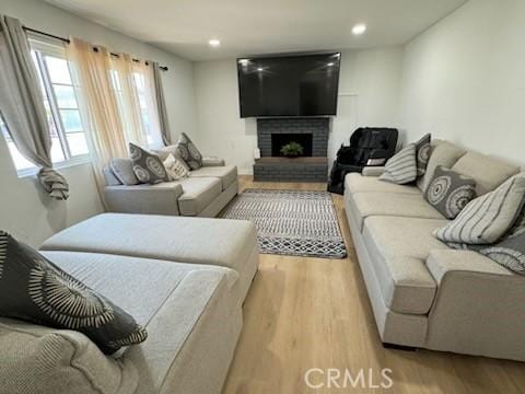 1308 Dixon Ct, Chula Vista, CA 91911 - living area with wood finished floors, a fireplace, and recessed lighting