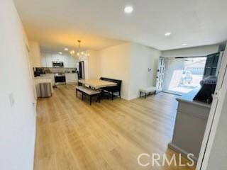 1308 Dixon Ct, Chula Vista, CA 91911 - living room featuring light wood finished floors, a chandelier, and recessed lighting