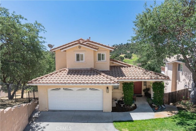 8674 Paseo De Vaca, Atascadero, CA 93422 - mediterranean / spanish house featuring a tile roof, concrete driveway, stucco siding, and an attached garage