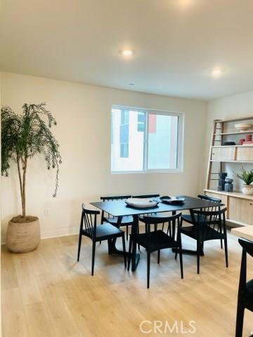 1810 E First St Unit 29, Santa Ana, CA 92705 - dining space featuring light wood finished floors and baseboards