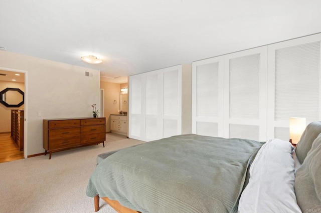 2005 Countrywood Ct, Encinitas, CA 92024 - bedroom with two closets, light carpet, and ensuite bath