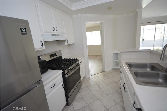 16377 Lakeshore Dr Unit 4D, Lake Elsinore, CA 92530 - kitchen featuring appliances with stainless steel finishes, under cabinet range hood, crown molding, white cabinetry, and light countertops
