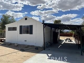 62026 Grand View Cir, Joshua Tree, CA 92252 - view of outbuilding with concrete driveway and an attached carport