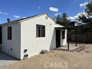 62026 Grand View Cir, Joshua Tree, CA 92252 - rear view of house featuring stucco siding