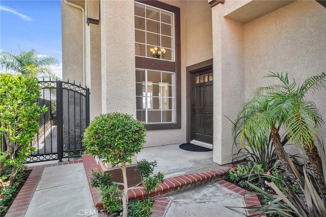19900 Mariposa Creek Way, Porter Ranch, CA 91326 - property entrance with stucco siding and a gate