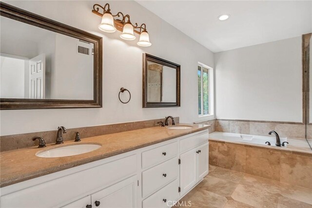 19900 Mariposa Creek Way, Porter Ranch, CA 91326 - bathroom featuring a bath, double vanity, and recessed lighting