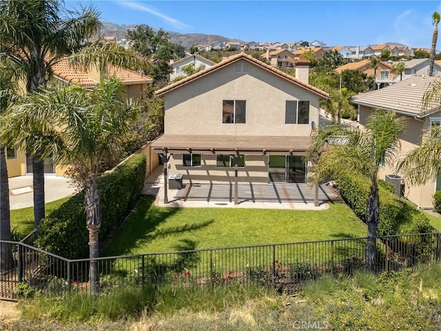 19900 Mariposa Creek Way, Porter Ranch, CA 91326 - rear view of house with a fenced backyard, stucco siding, a patio, and a chimney