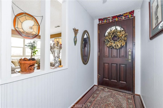 1595 15th St, Los Osos, CA 93402 - entryway with wood finished floors and a textured ceiling