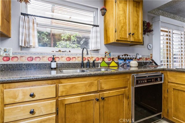 1595 15th St, Los Osos, CA 93402 - kitchen featuring brown cabinets and dishwasher