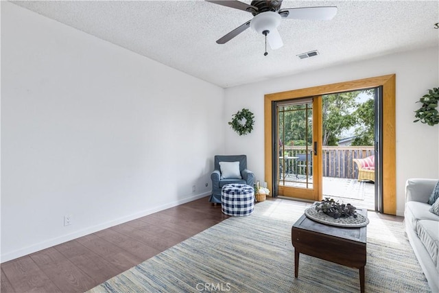 1595 15th St, Los Osos, CA 93402 - sitting room with wood finished floors, a textured ceiling, and a ceiling fan