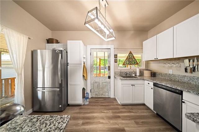 1711 Shasta St, Anderson, CA 96007 - kitchen featuring stainless steel appliances, white cabinetry, and dark wood finished floors