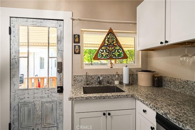 1711 Shasta St, Anderson, CA 96007 - kitchen featuring white cabinets, healthy amount of natural light, and light stone countertops