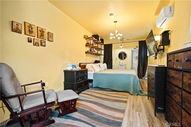 1711 Shasta St, Anderson, CA 96007 - bedroom with a wall mounted AC, wood finished floors, and a chandelier